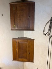 Apair of oak wall hung oak