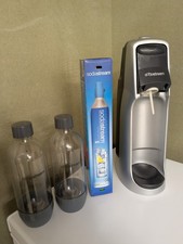 soda stream machine with new cannister and 2 bottles