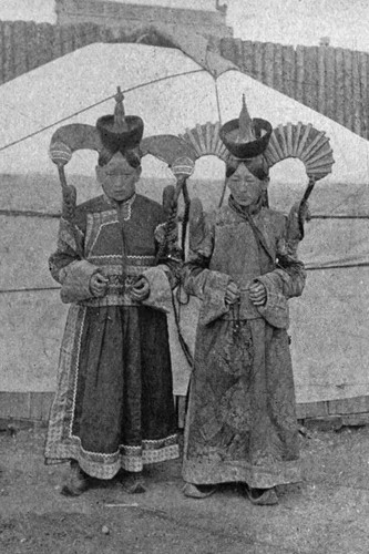 Mongol women beside yurt - women,