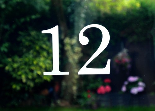 Traditional house number door