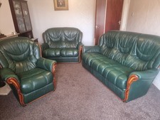 Three Piece Suite  In Dark Green Leather