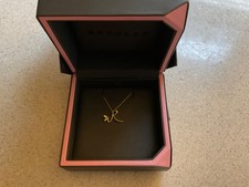 gold necklace with letter R