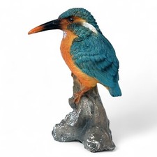Kingfisher figurine on branch