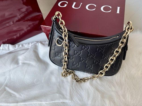 Gucci black emblem leather - gucci,