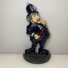Vintage Cast Iron MINSTER Cop