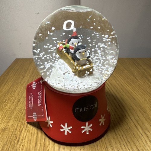 Penguin sleighing red snow - m&s,
