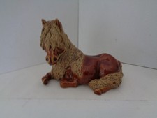 Cheval ceramics seated pony