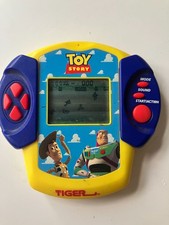 Toy Story Handheld Game - Tiger Electronics 1999 with battery cover WORKING