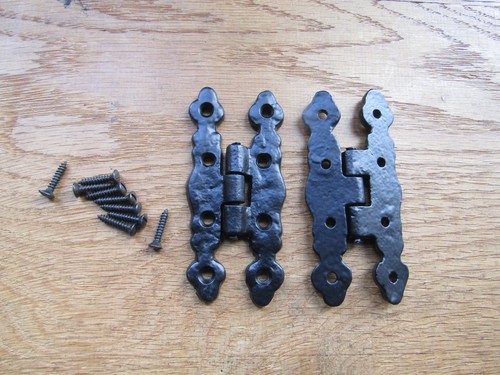 Pair rustic iron butt - of,