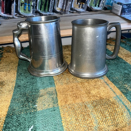 Two pewter tankards one - pewter, is