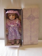 NEW LEONARDO COLLECTION  17" PORCELAIN DOLL.