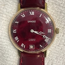 Sandoz Swiss 17 Jewels Incabloc Watch Red Dial Roman Numerals Gold Plate. 