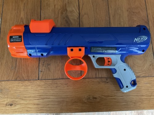 Nerf dog shoots tennis - shoots,