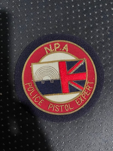 Police pistol expert - n,