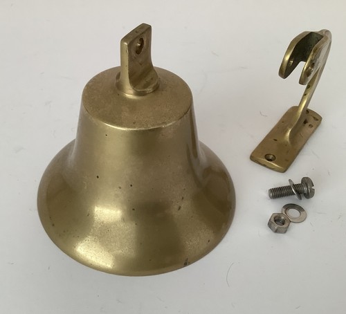 Vintage ships bell with wall