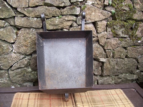Old metal forged wheelbarrow - old,