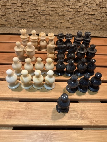 Hand carved stone chess - hand, pieces