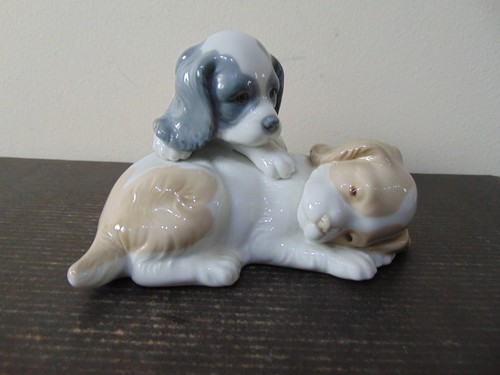 Nao lladro playful - “playful, pups”