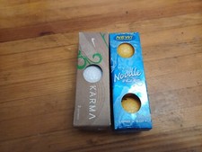 6 golf balls, nike karma, and