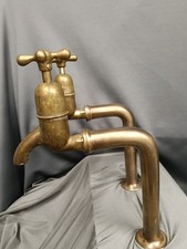 TALL BRASS BIB TAPS, AGED