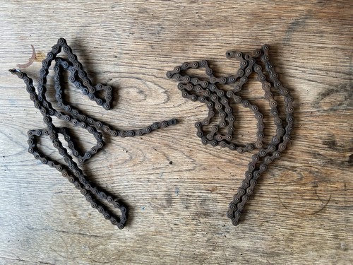 Two dirty bike chains - two,