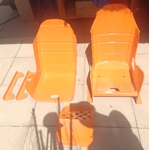 Orange metal bucket seats with - metal,