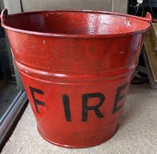 A Vintage Industrial Red Painted Fire Bucket 