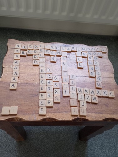 Wooden scrabble tiles in - wooden,
