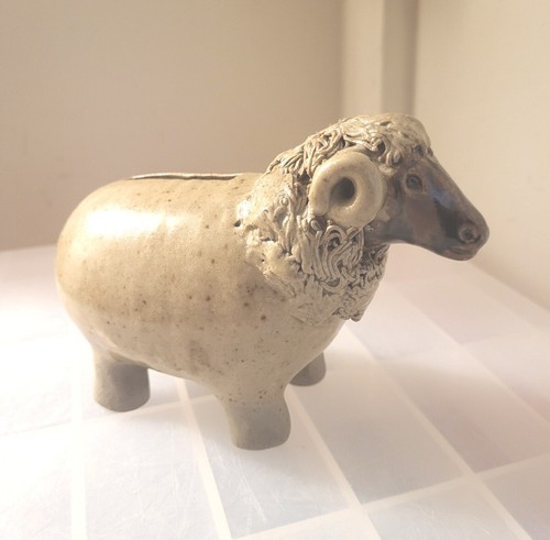 Ram pottery money box hand - money,