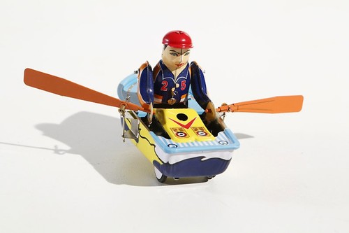 Rowing boat tin toy - rowing,