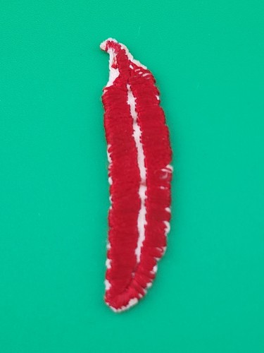 Small red feather - small, bsa