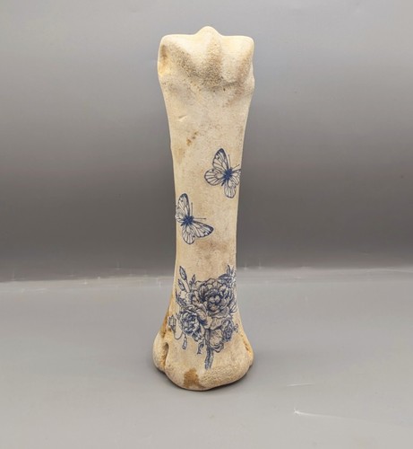 Decorated cow leg bone - leg,