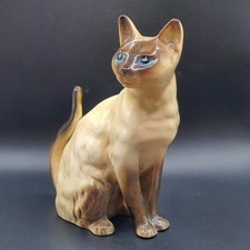 Ceramic sitting Siamese cat made in England
