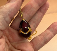Beautiful deep burgundy enamel egg necklace  36” gold tone Joan Rivers??