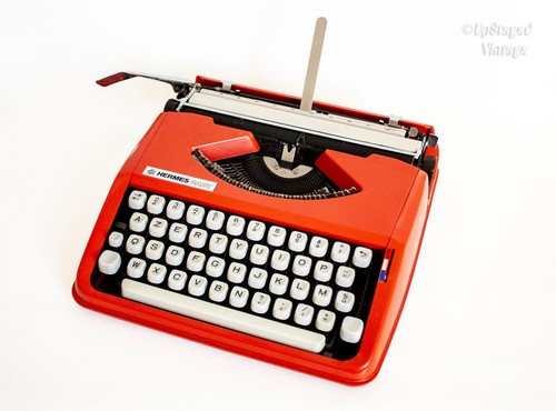 Orange hermes baby typewriter - baby,