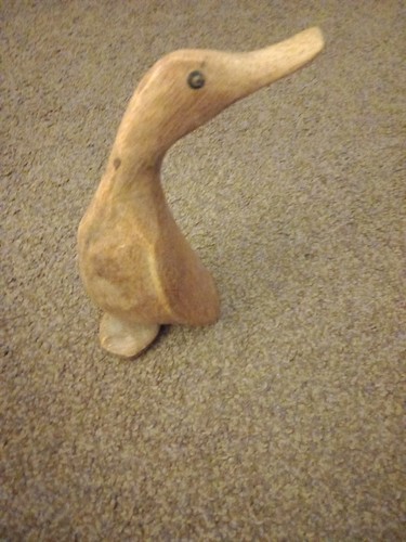 Wooden hand carved duck - hand,