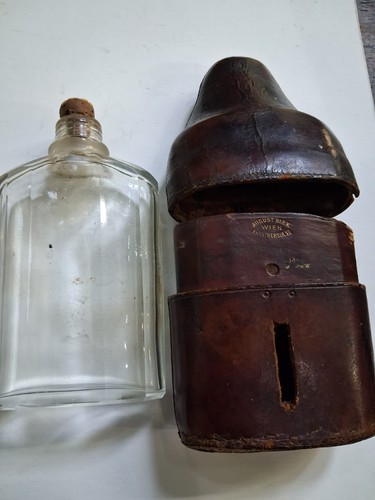 Antique glass and leather hip - and,