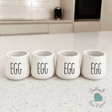 Dimples Egg Cup Set of 4 Ceramic White Glaze with Black Embossed Writing