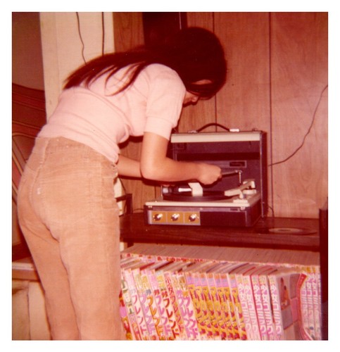 1970s teen girl playing record - teen,