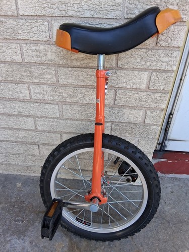 Orange and black - and, unicycle
