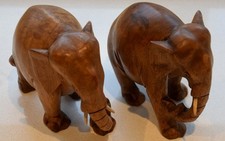 A PAIR OF VINTAGE HAND CARVED WOODEN ELEPHANTS EXCELLENT CONDITION.