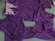 Punjabi suit for women in purple with silver sequins.