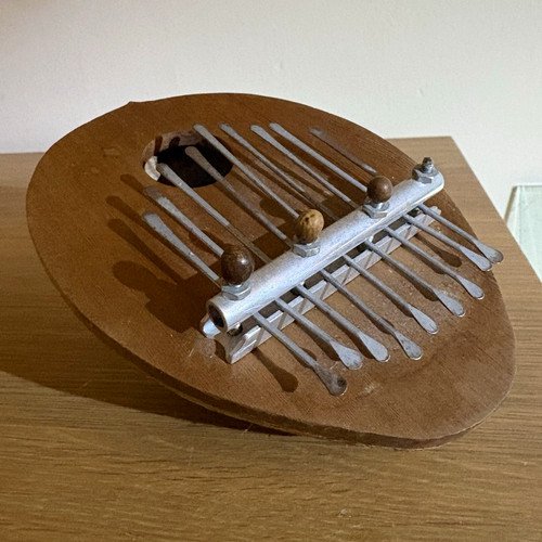 Coconut shell kalimba thumb - coconut,