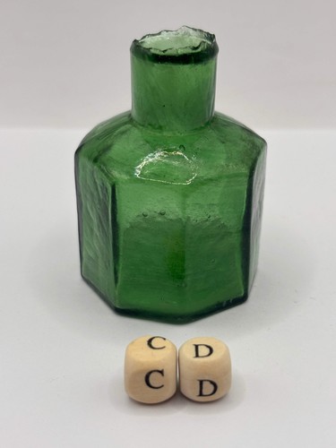 Old green glass ink bottle