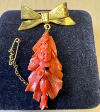 ANTIQUE CARVED CORAL CHERUB BROOCH