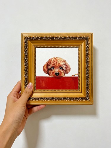 Brown puppy peeking over red - puppy,