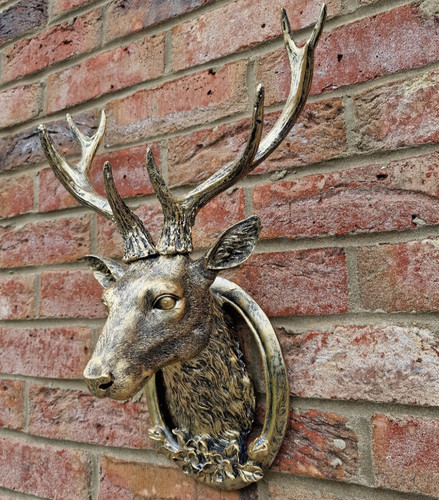 Wall mounted gold stag head - mounted,