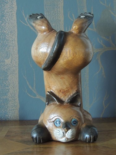 Carved wooden cat handstanding - carved,