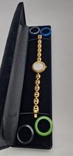 Gucci 11/12.2 Lady's Gold Plated Bracelet Watch with Five Interchangeable Bezels