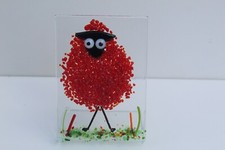 colourful naughty sheep in fused glass. They're  freestanding, fun sun catchers